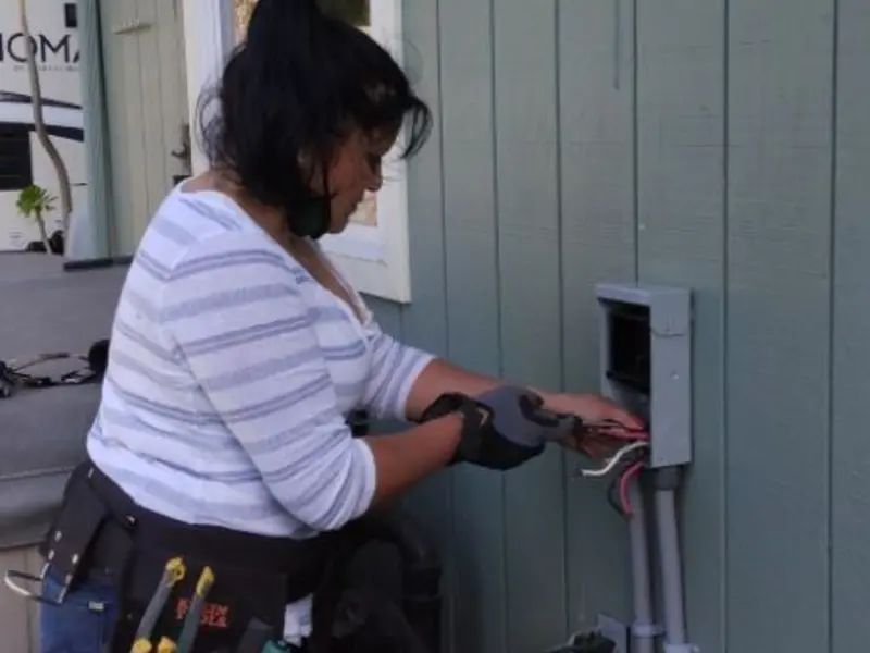 Licensed electrician wiring an exterior subpanel in Caln